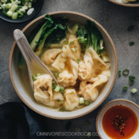 Wonton soup - easy pork and shrimp wontons served in a hearty chicken soup. An authentic Chinese street vendor soup base is also included in the recipe! #chinese #dimsum #dumplings