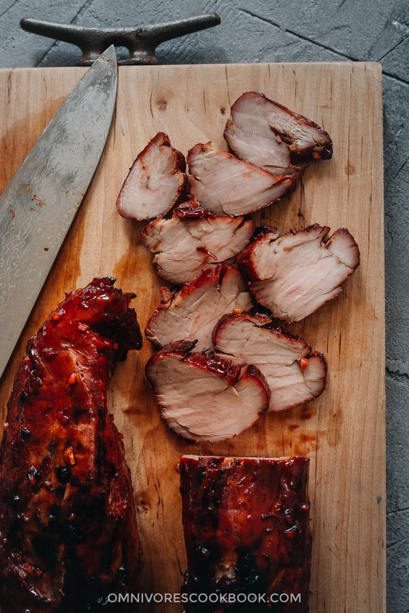 Sliced Chinese BBQ pork on cutting board