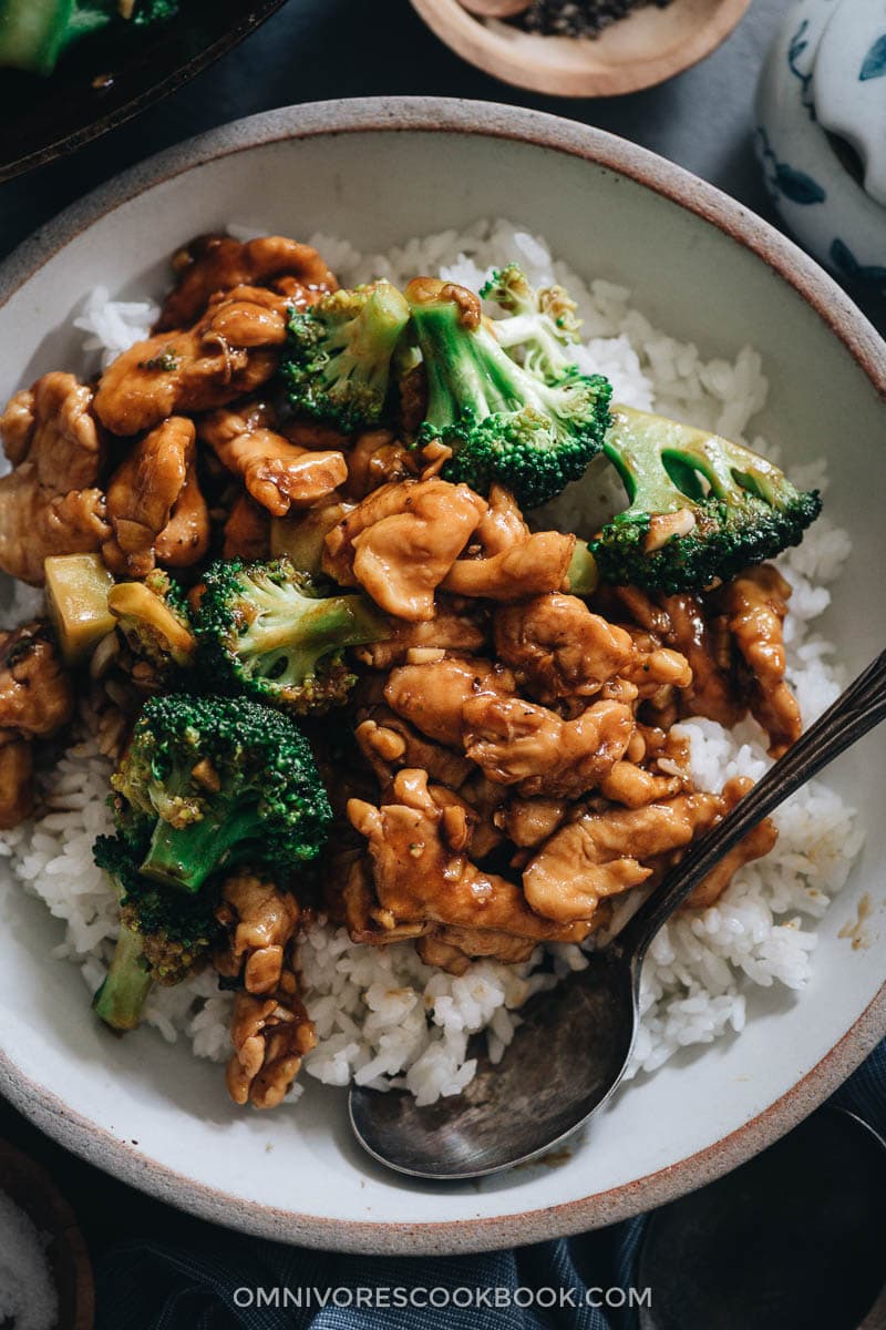 Stir fried chicken with broccoli served on steamed rice