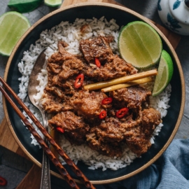 Beef Rendang | This dish features buttery, juicy beef smothered in a thick, rich, caramelized aromatic curry sauce. Learn how to make authentic Indonesian beef rendang in your own kitchen with an easy approach. You can also use a slow cooker to make this recipe. {Gluten-Free}