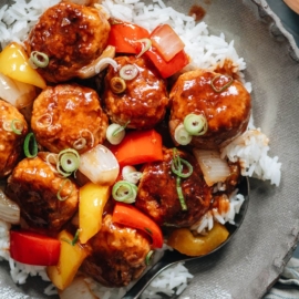 Meatballs with sweet and sour glaze over rice