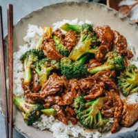 This beef and broccoli is a popular Chinese take-out meal and it's also easy enough to make at home. It's also healthier than most take-out meal options. With juicy tender beef and crisp broccoli brought together in a rich brown sauce, this quick dinner is as colorful as it is delicious. Serve it over hot rice for an authentic Chinese take-out dinner. {Gluten-Free Adaptable}