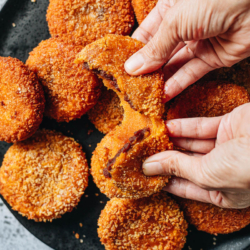 Chinese pumpkin cake features a beautiful golden crispy crust that is gooey and sticky like mochi inside, with a sweet red bean paste filling. It makes a delicious and healthy dessert for after dinner and a fun snack during Chinese festivals. The recipe includes the traditional frying method and an air fryer method. {Gluten-Free, Vegan}