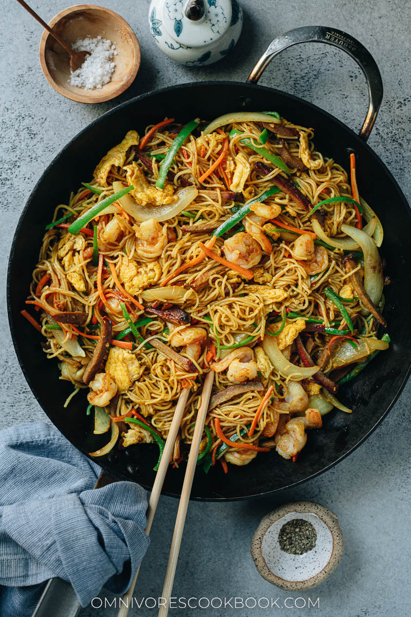 Singapore noodles loaded with shrimp, char siu pork, egg, onion, and pepper
