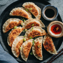 Egg and pepper dumplings feature soft scrambled eggs, browned mushroom bits, and bright green pepper stuffed into crispy wrappers. These dumplings are easy to make and so fun to eat. You can serve them as a vegetarian main dish, a fun appetizer for your dinner party, or as part of your Chinese New Year spread. {Vegetarian}