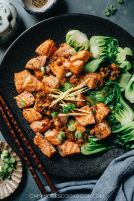 Pan fried salmon served with baby bok choy close up