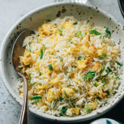 A super easy egg fried rice that you can prep and cook in 10 minutes, featuring tender eggs with crispy rice simply seasoned with scallions and salt. It is the perfect side dish for your Chinese dinner, or you can even serve it by itself as a light meal. {Vegetarian, Gluten-Free}