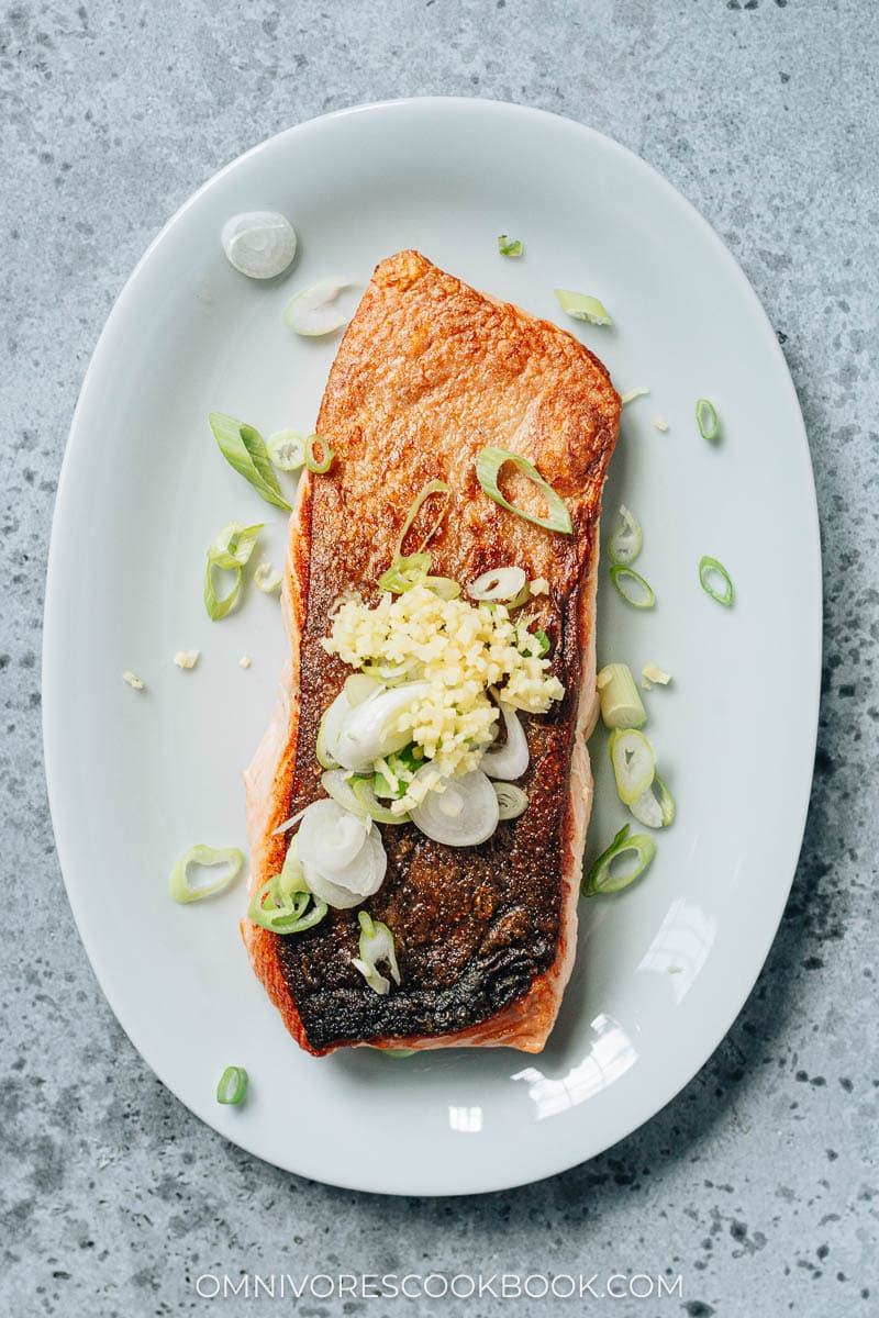 Pan fried fish topped with aromatics