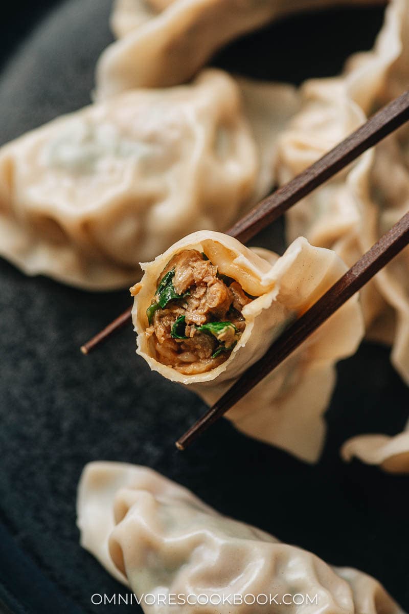 Pork and chive dumpling with filling exposed